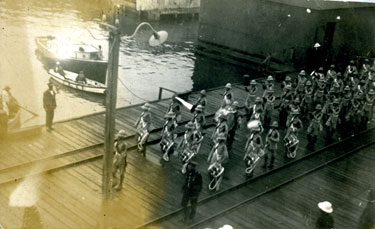 The 1st Battalion drums and the Jamaica military band marching on the docks.