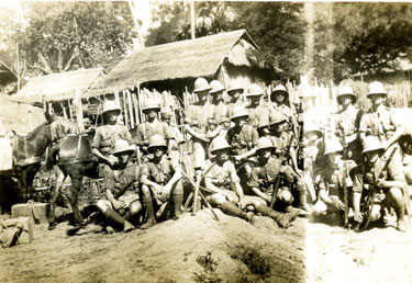  Lieutenant T B L Churchill and his platoon on patrol with mules, in Burmese village