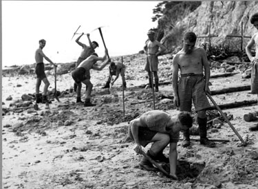 Members of the 1st Battalion building an anti boat obstacle on defence exercises.