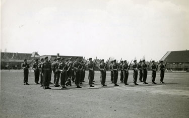 Captain Clutterbuck inspecting rifles of the Guard on the Berlin Parade Ground.