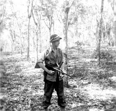 Unidentified soldier posing with Owen gun