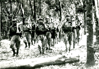 Communist terrorists in training in jungle camp.
