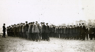 Lines of new recruits in civilian dress