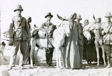 Group of men with donkeys and local men