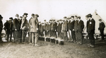 Men from the Pals Battalions observing buckets