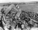 View: MR00468 Men from the 20th Battalion resting by a disabled tank