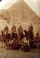 View: MR00587 Group of 9th battalion Warrant Officers and NCO's riding camels, sphonx and pyramids in background.