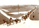 View: MR00957 Group of soldiers and local men transporting equipment across the Curragh Plain, Co Kildare.