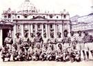 View: MR01365 3529484 Corporal George Holmes is 2nd left on front row, with a group of men from various men from various regiments on a leave party outside the Vatican.