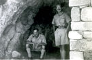 View: MR01416 Two unidentified men in a dugout on Toaidin(?) Ridge.