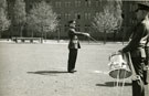 View: MR01489 Bandmaster Spooner conducting the Band and Drums during inspection.