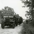 View: MR01717 Colour Sergeant Harold Bellis (on right) watching as patrol is collected following three days in the jungle.