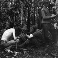 View: MR01722 Major H T Roberts on left with wireless operator in jungle camp