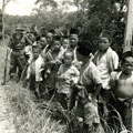 View: MR01756 Private Sheffield from 'B' Company with a group of Malay children