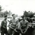 View: MR01770 Wall, Corporal Gorman and Bridgeman standing in front of a Dingo armoured vehicle.