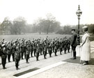 View: MR02048 Detachment of men from Manchester Regiment raise their caps to cheer King George V and Queen Mary