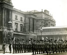 View: MR02049 Detachment of men from Manchester Regiment raise their caps to cheer King George V and Queen Mary