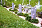 View: MR02185 Headstone dedicated to three men from the Manchester Regiment who died during the Malayan conflict. The graves are in Taiping Cemetery.