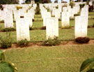View: MR02290 Kranji Military Cemetery showing the graves of two unknown Manchester Regiment soldiers.