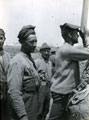 View: MR02415 Sergeant W Hufton using a periscope in 'A' Company trench.
