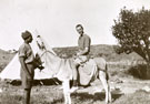 View: MR02441 Lieutenant J A C Taylor on donkey