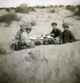 View: MR02519 Four officers enjoying lunch in dugout
