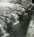 View: MR02540 Soldiers in gas masks rehearsing attack in trench