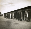 View: MR02543 Arab Women's clothing airing outside hut