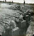 View: MR02545 Men in trench wearing gas masks and carrying rifles