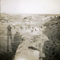 View: MR02592 Shadow of two soldiers and horse looking at camp in desert