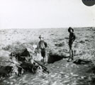 View: MR02642 Soldiers with dugout in desert
