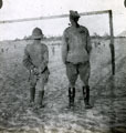View: MR02643 Two officers watching a football match in the desert