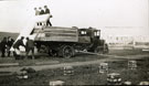 View: MR02674 Group of new recruits unloading pre-formed hut sections