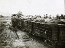 View: MR02707 Men of 16th Battalion watch as their dead are loaded onto narrow guage railways trucks during the autumn fighting in the areas of Flers and Ligny-Thilloy