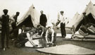 View: MR02837 New recruits in civilian dress working on the flooring of the tent