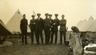 View: MR02849 New recruits in civilian clothes with a corporal in front of tents with kit