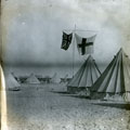 View: MR02871 Tents in the desert with Union flag and St George’s flag flying