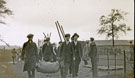 View: MR02907 Group of men from the Pals Battalions carrying equipment for the erection of tents and hutments in Heaton Park