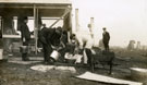 View: MR02925 Group of men from the Pals Battalions in the process of erecting hutments and tents in Heaton Park