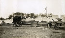 View: MR02926 Hutments in the process of construction next to tents at Heaton Park