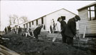 View: MR02932 Council workmen digging footments for the next row of hutments in Heaton Park